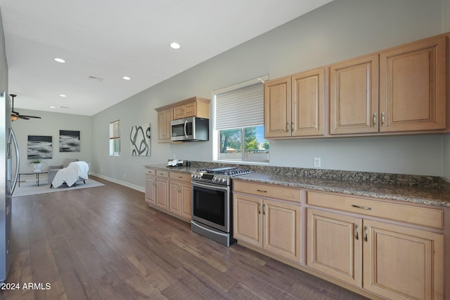 kitchen featuring dark wood-type flooring, ceiling fan, appliances with stainless steel finishes, and light brown cabinets