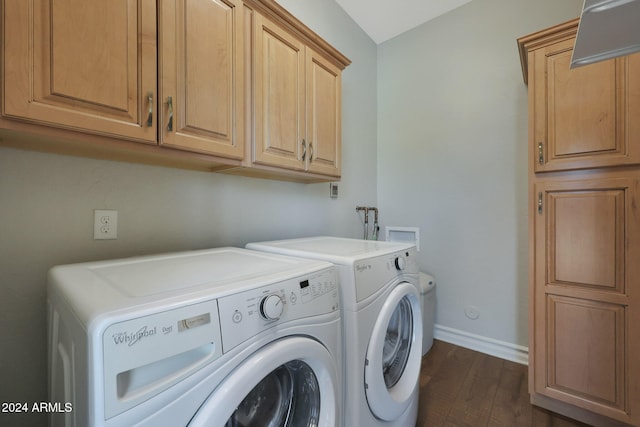 washroom with cabinets, dark wood-type flooring, and washing machine and clothes dryer