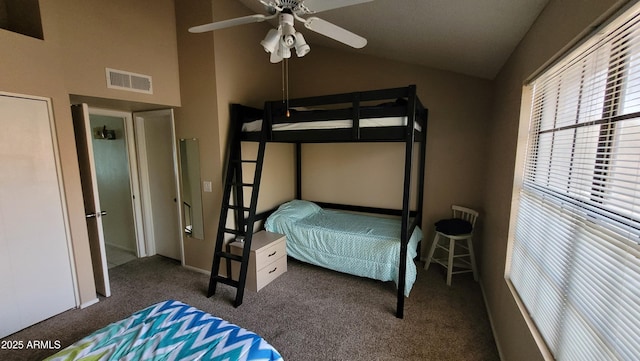 carpeted bedroom with lofted ceiling and ceiling fan