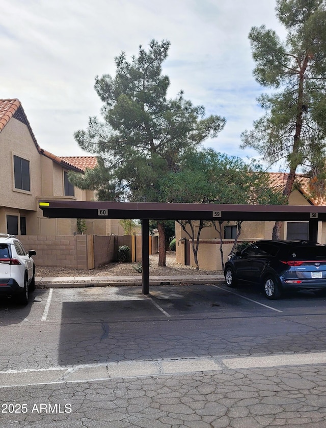 view of vehicle parking with a carport