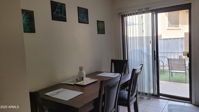 dining space with light tile patterned floors