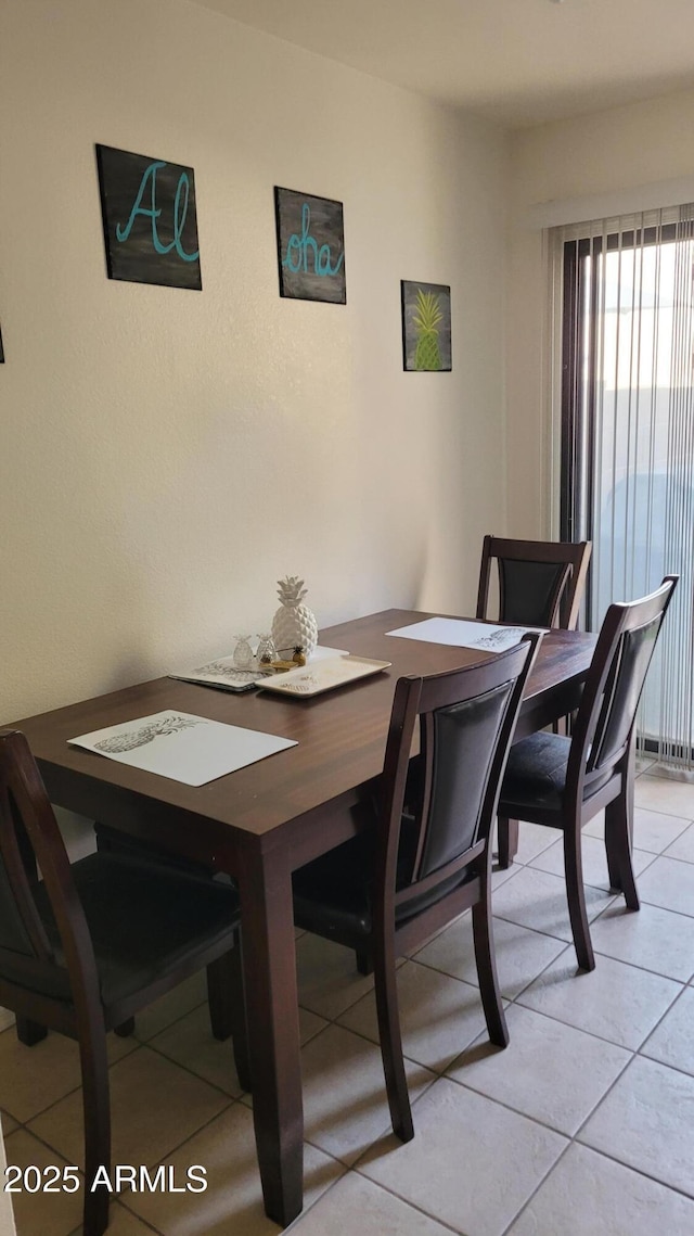 view of tiled dining space