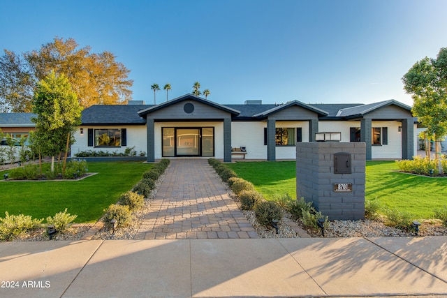 ranch-style house with a front yard