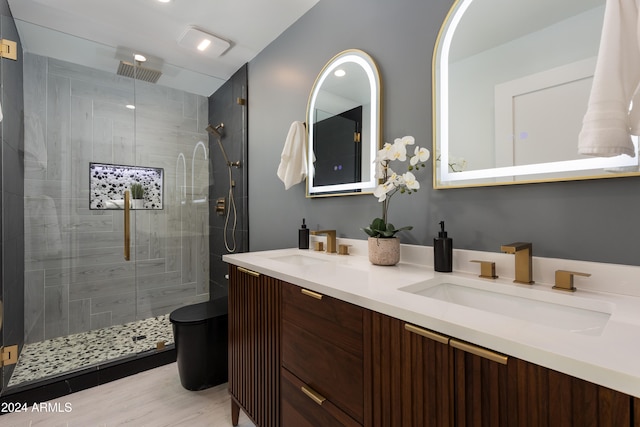 bathroom featuring vanity, hardwood / wood-style flooring, and walk in shower