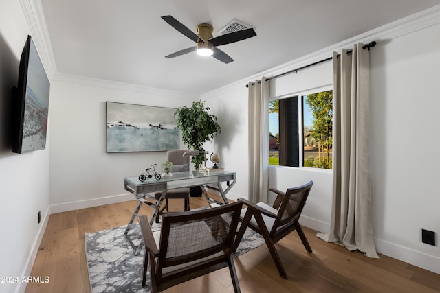 office area featuring wood-type flooring, ceiling fan, and ornamental molding