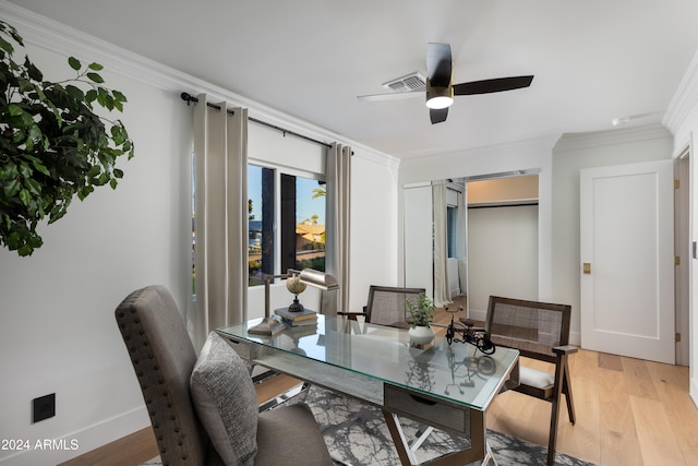 office space with ceiling fan, light wood-type flooring, and ornamental molding