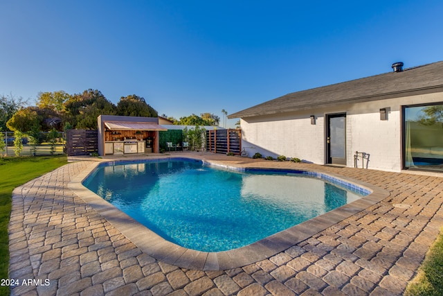 view of swimming pool featuring a patio