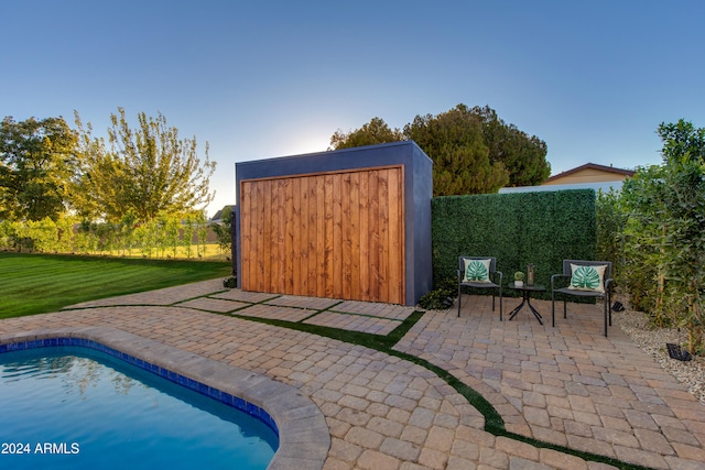 exterior space with a fenced in pool and a shed