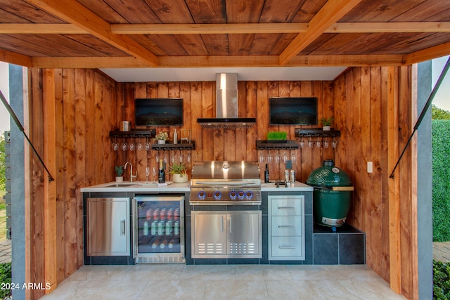 bar with stainless steel fridge, wall chimney exhaust hood, and wooden ceiling