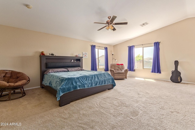 carpeted bedroom featuring ceiling fan and vaulted ceiling