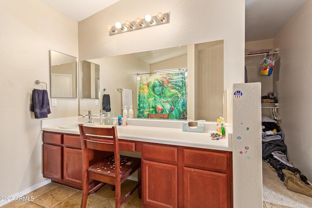 bathroom with tile patterned flooring, vanity, lofted ceiling, and a shower with shower curtain