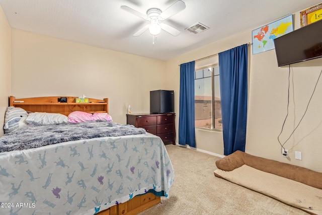 carpeted bedroom featuring ceiling fan