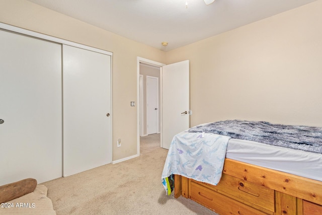 carpeted bedroom with a closet