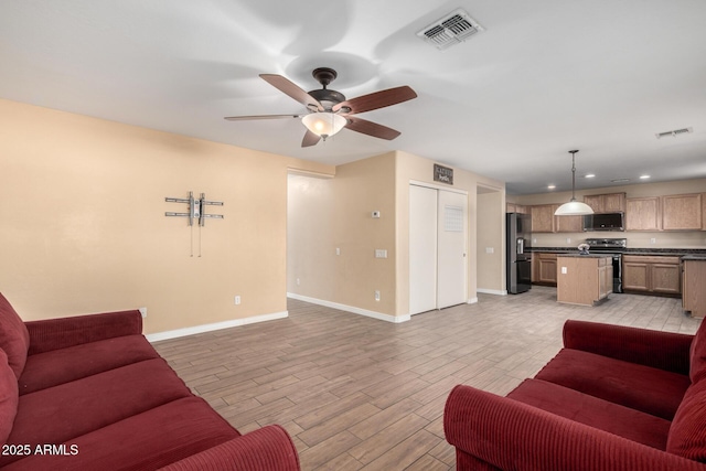 living room with ceiling fan