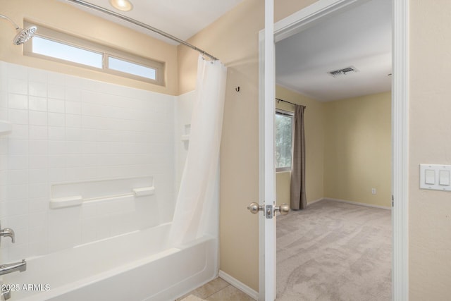 bathroom with shower / bath combination with curtain