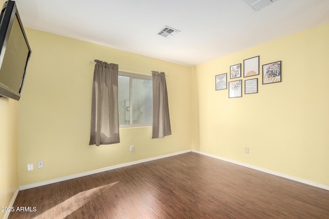 unfurnished room featuring dark hardwood / wood-style floors