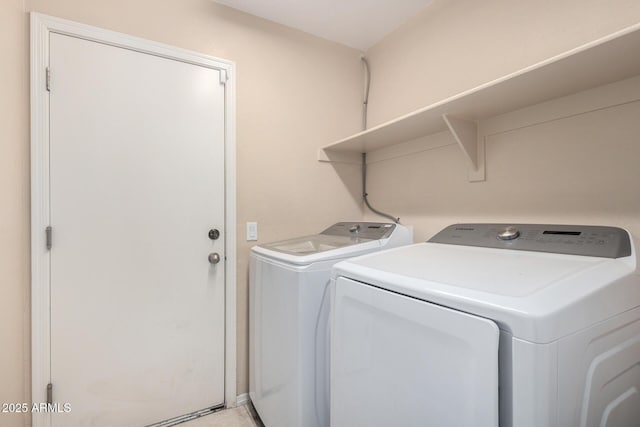 washroom with washer and dryer