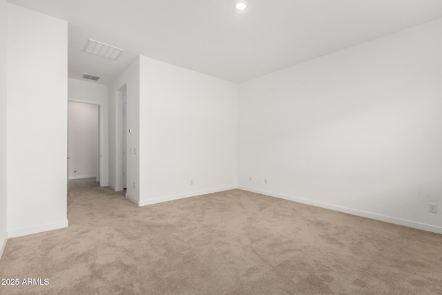 empty room with light colored carpet