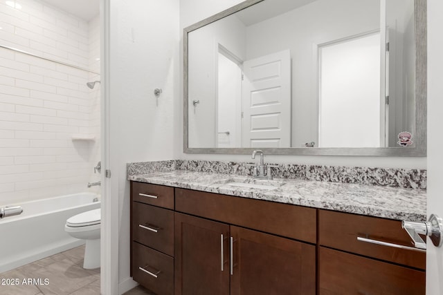 full bathroom with toilet, vanity, and  shower combination