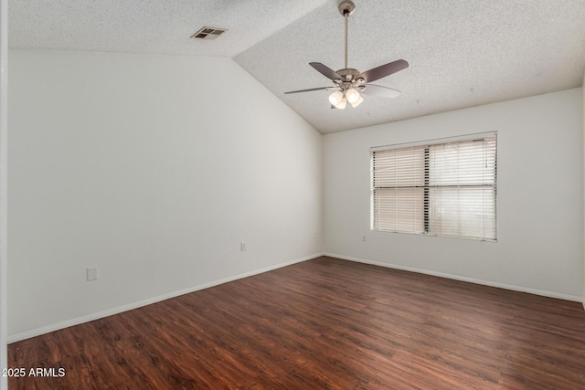 1425 E Commerce Ave, Gilbert, AZ 85234 - unfurnished room with a textured ceiling, a ceiling fan, dark wood-style flooring, vaulted ceiling, and baseboards