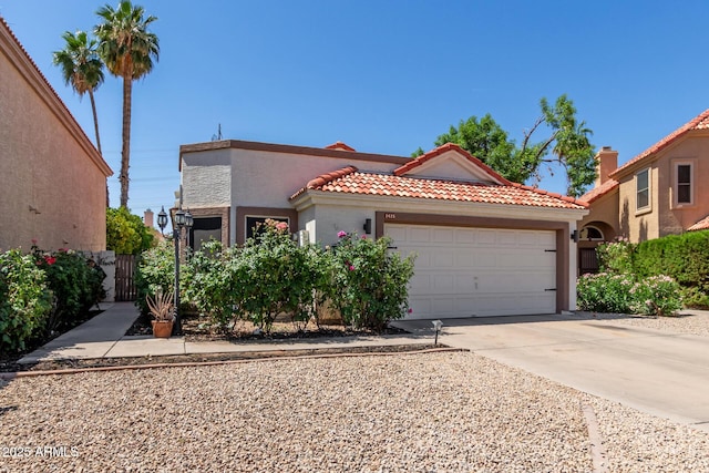 1425 E Commerce Ave, Gilbert, AZ 85234 - mediterranean / spanish-style house with a garage, driveway, stucco siding, and a tile roof