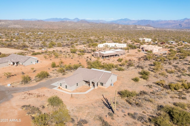 bird's eye view with a desert view and a mountain view