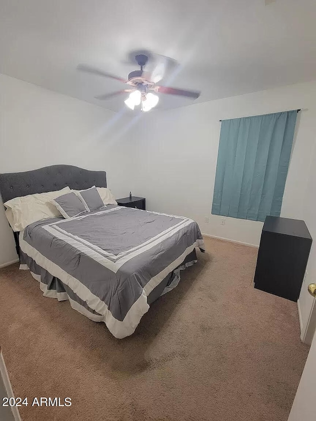 carpeted bedroom featuring ceiling fan