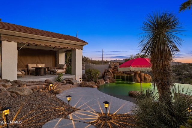 patio terrace at dusk with outdoor lounge area