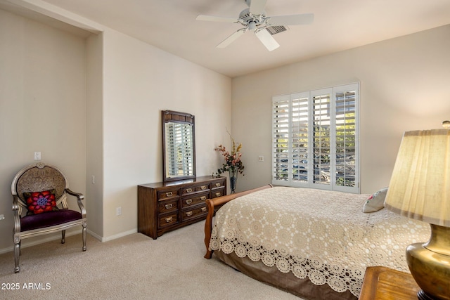 bedroom featuring light carpet and ceiling fan