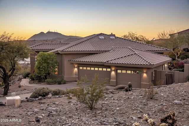 view of front of house featuring a mountain view and a garage