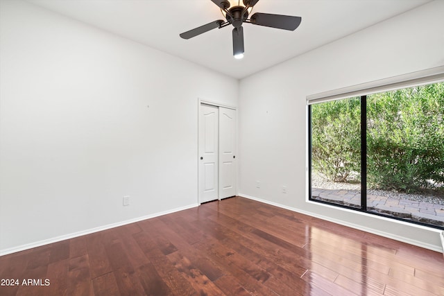 empty room with ceiling fan and hardwood / wood-style floors