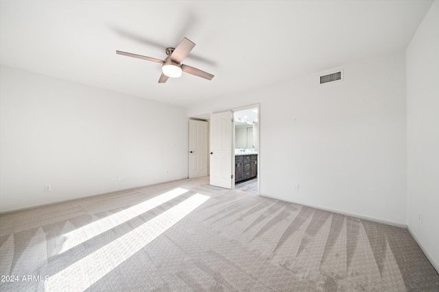 unfurnished room with light carpet and ceiling fan