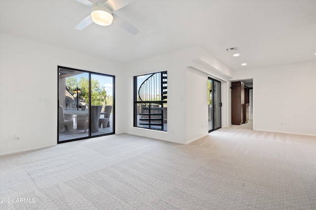 empty room with light carpet and ceiling fan