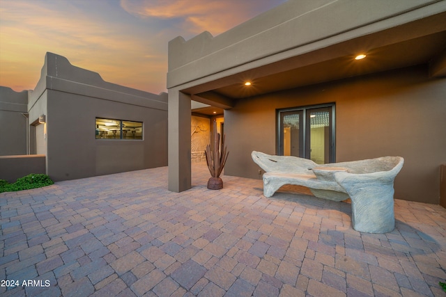 view of patio terrace at dusk