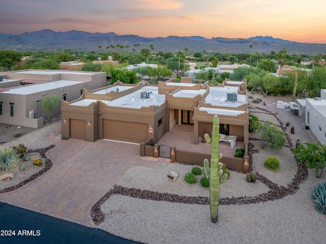 aerial view at dusk with a mountain view