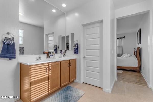 bathroom featuring vanity and wood-type flooring