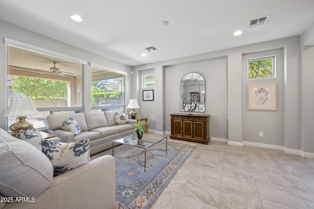 living area featuring recessed lighting, visible vents, baseboards, and a ceiling fan