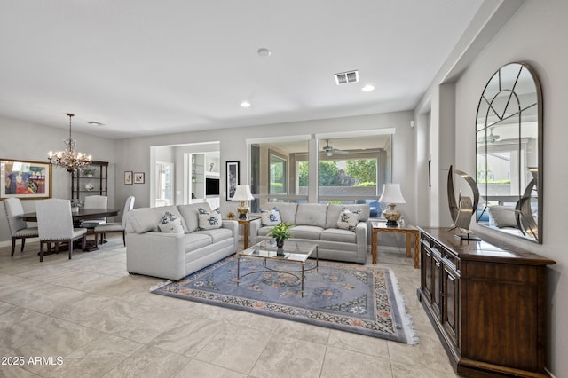 living room featuring a notable chandelier, recessed lighting, and visible vents