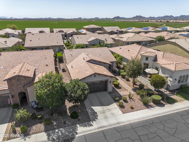 aerial view with a mountain view and a residential view