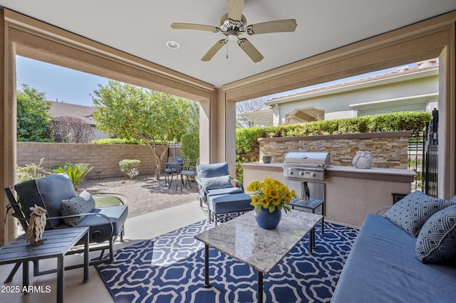 view of patio / terrace featuring a ceiling fan, fence, area for grilling, grilling area, and outdoor lounge area