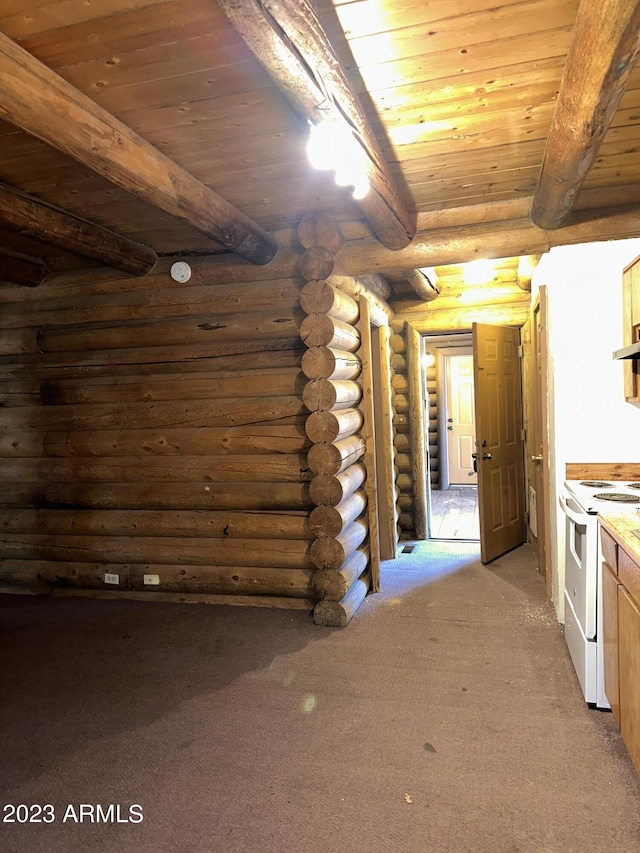 kitchen featuring light carpet, wood ceiling, rustic walls, and white range with electric stovetop