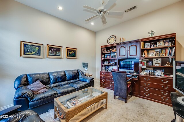 carpeted home office with ceiling fan