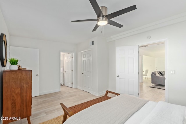 bedroom with ceiling fan and light hardwood / wood-style flooring