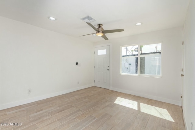 unfurnished room featuring light hardwood / wood-style flooring and ceiling fan