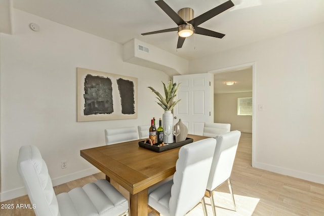 dining room featuring ceiling fan and light wood-type flooring