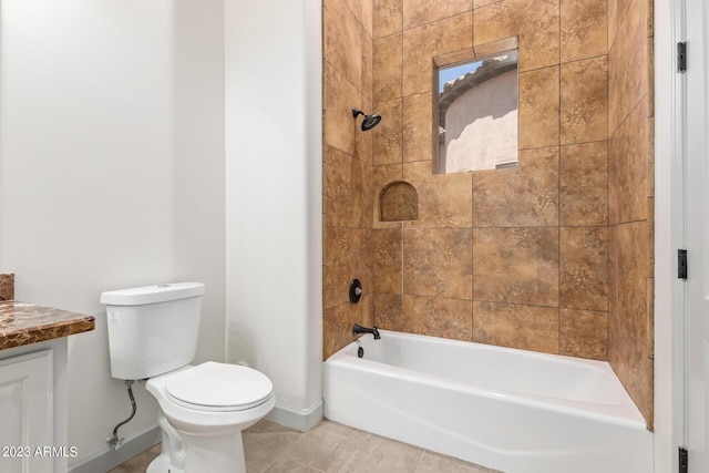 full bathroom with tile patterned flooring, vanity, toilet, and tiled shower / bath combo