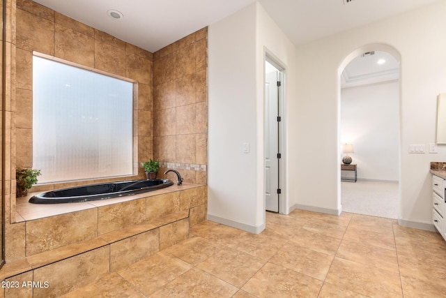 bathroom with vanity and a bath