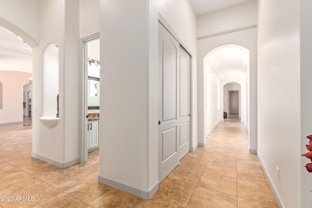 corridor featuring light tile patterned flooring