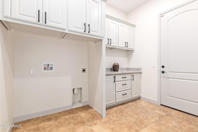 washroom with electric dryer hookup, cabinets, and washer hookup