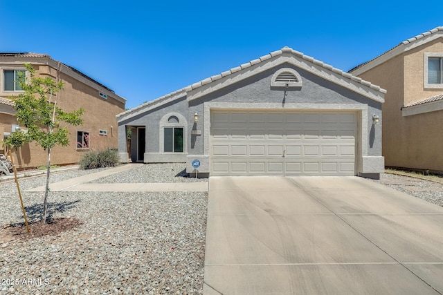 12318 W Bloomfield Rd, El Mirage, AZ 85335 - single story home with an attached garage, concrete driveway, a tile roof, and stucco siding